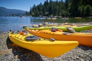 Kayaks on shore of Deep Cove in Vancouver, Canada